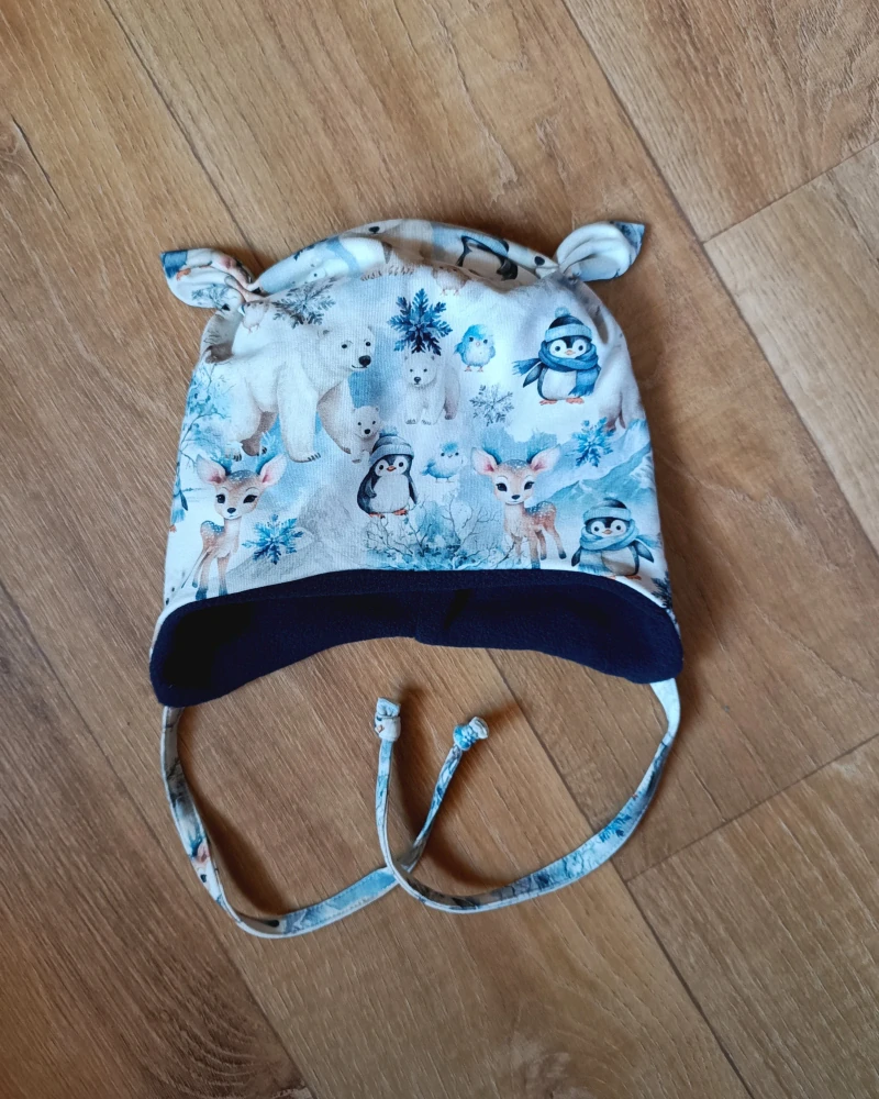 Zimní čepice na zavazování s oušky "Polární pohádka + tm. modrý fleece"